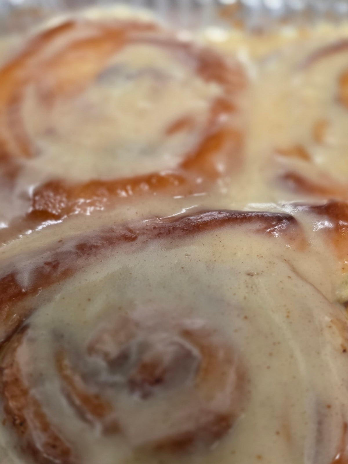 Glazed jumbo cinnamon bun close-up